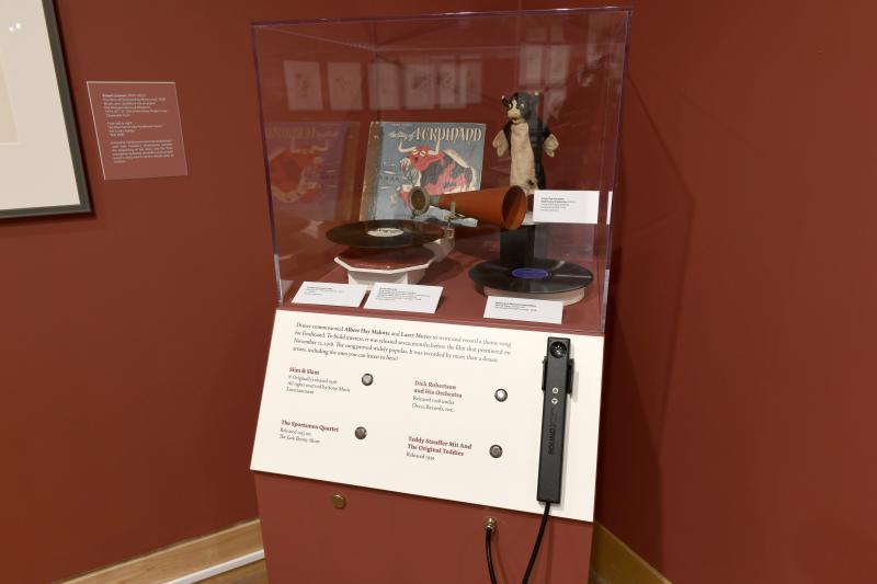 Photograph of gallery showing framed art and graphics.