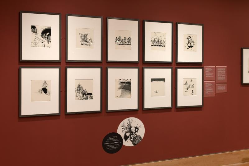 Photograph of gallery showing framed art and graphics.