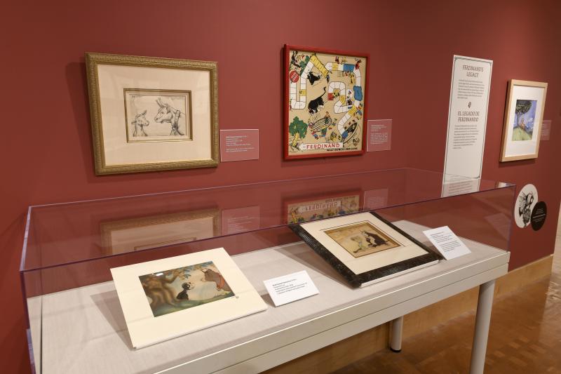 Photograph of gallery showing framed art and graphics.