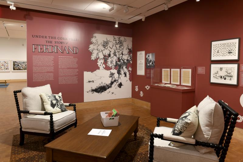 Photograph of gallery showing framed art and graphics.