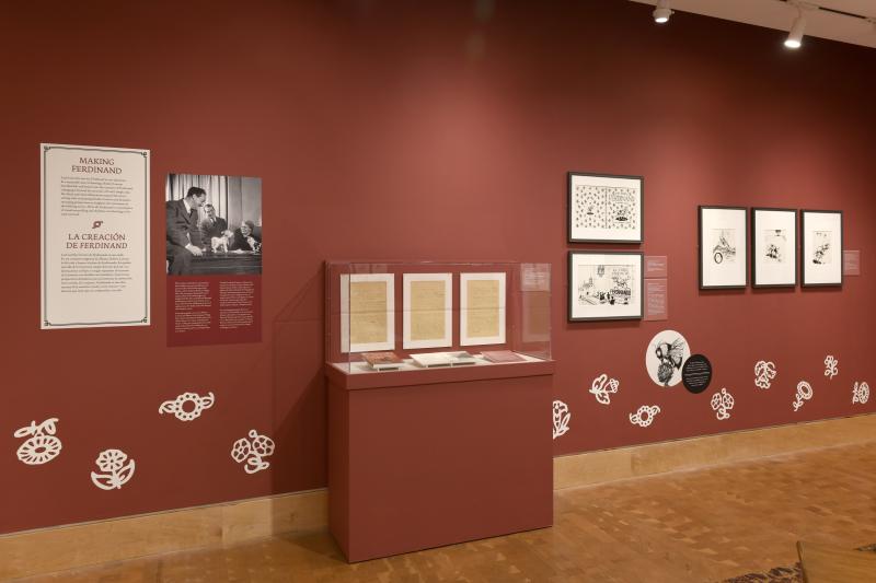 Photograph of gallery showing framed art and graphics.