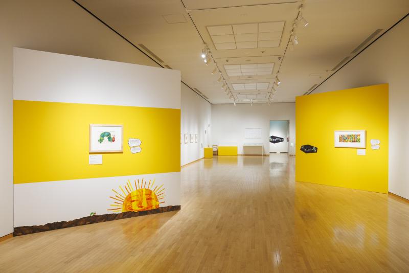 Photograph of gallery showing framed art and graphics.