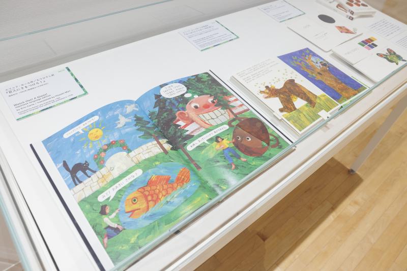 Photograph of gallery showing framed art and graphics.