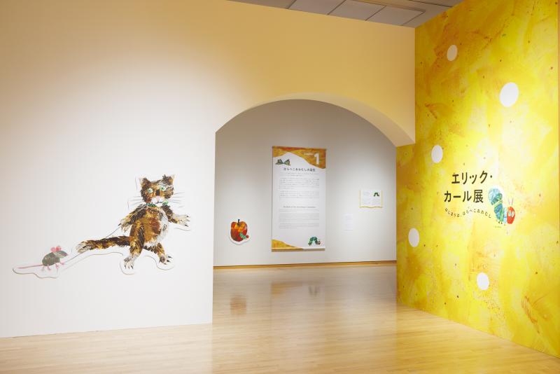 Photograph of gallery showing framed art and graphics.