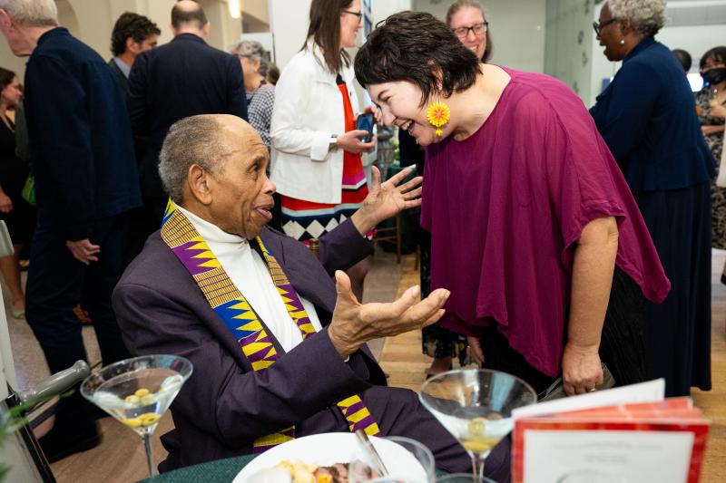 Two people in conversation at The Carle Honors.