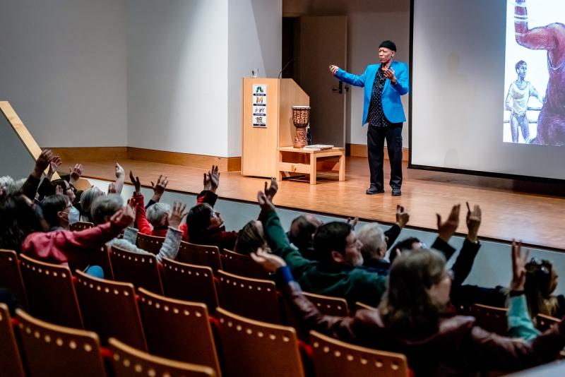 Brian Pinkney speaking onstage in the Auditorium.