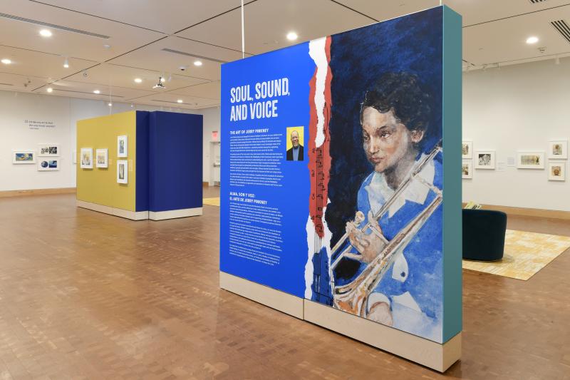 Photograph of gallery showing framed art and graphics.