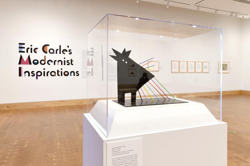 Photograph of gallery showing framed art and graphics.