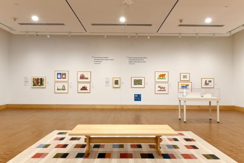Photograph of gallery showing framed art and graphics.