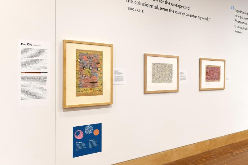 Photograph of gallery showing framed art and graphics.