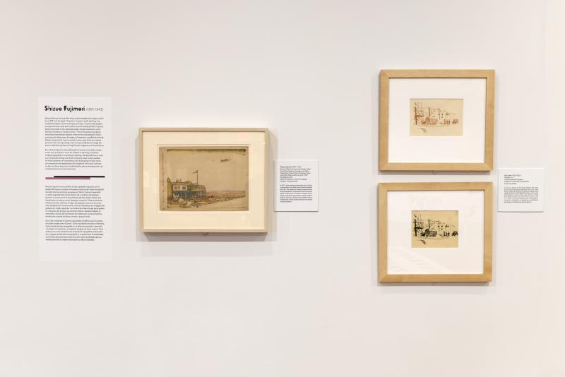 Photograph of gallery showing framed art and graphics.