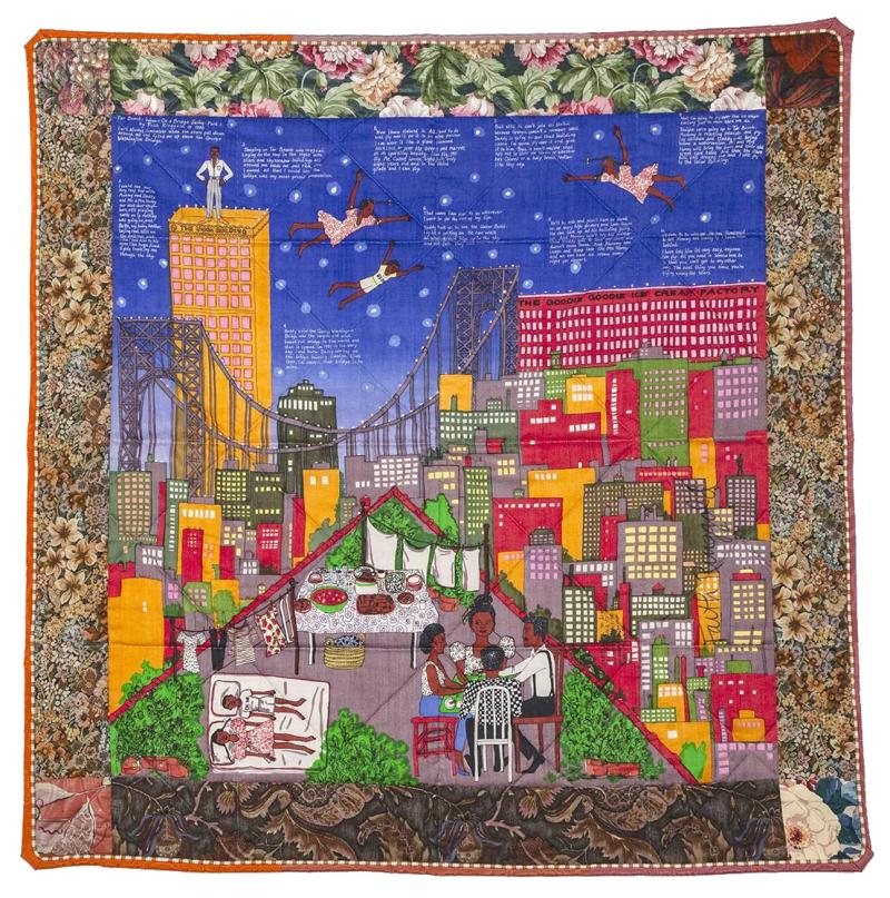 Quilt with figural images of cityscape.