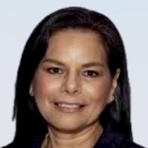 A woman with dark hair, smiling