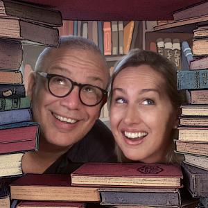 Photo of John and Hayley looking out from a pile of books.