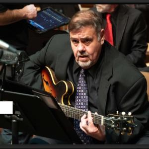 Man playing guitar.