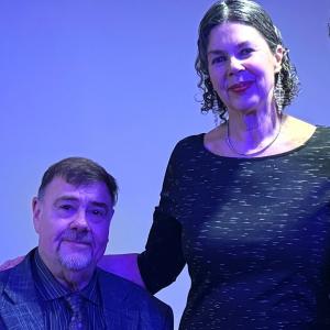 Mary Witt standing and Bob Ferrier sitting