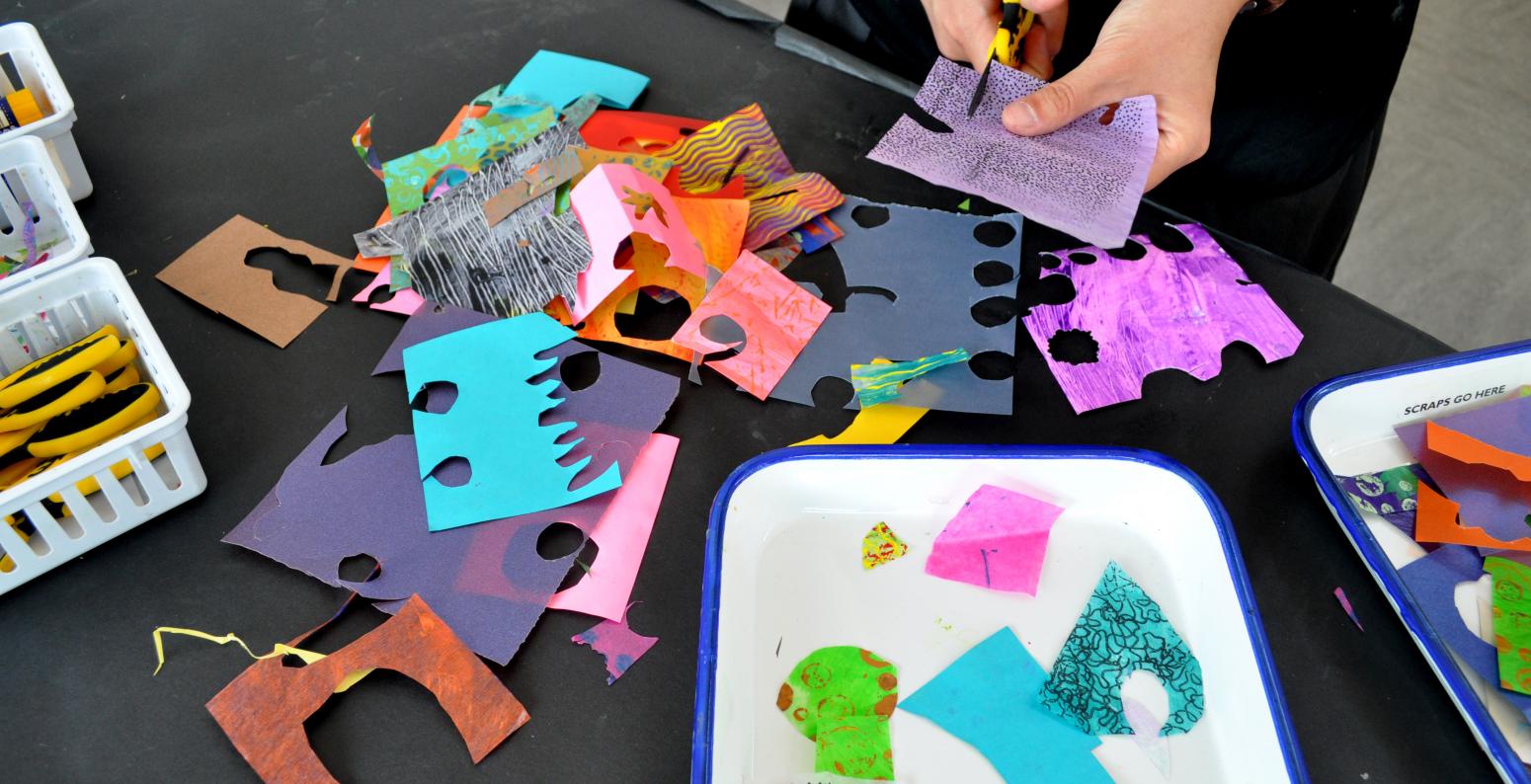 Colorful paper scraps being cut