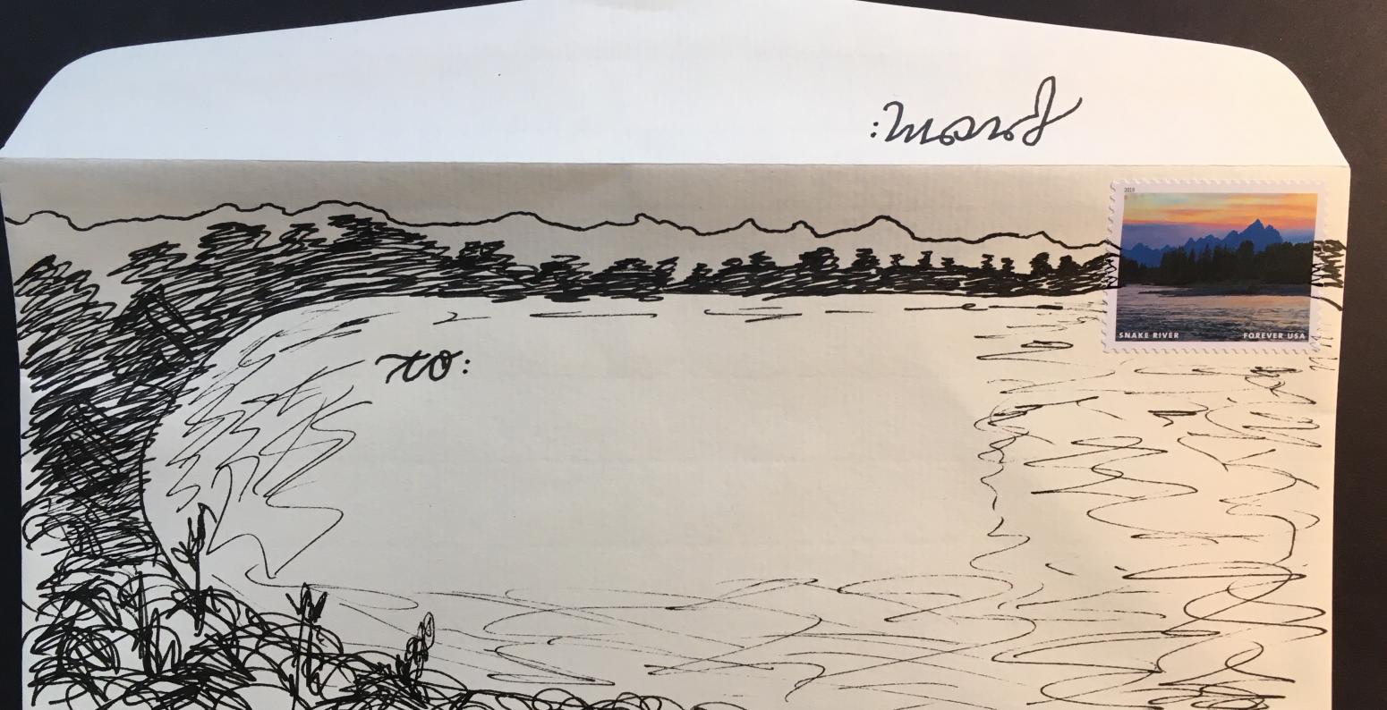 envelope with drawing of a shore and mountains