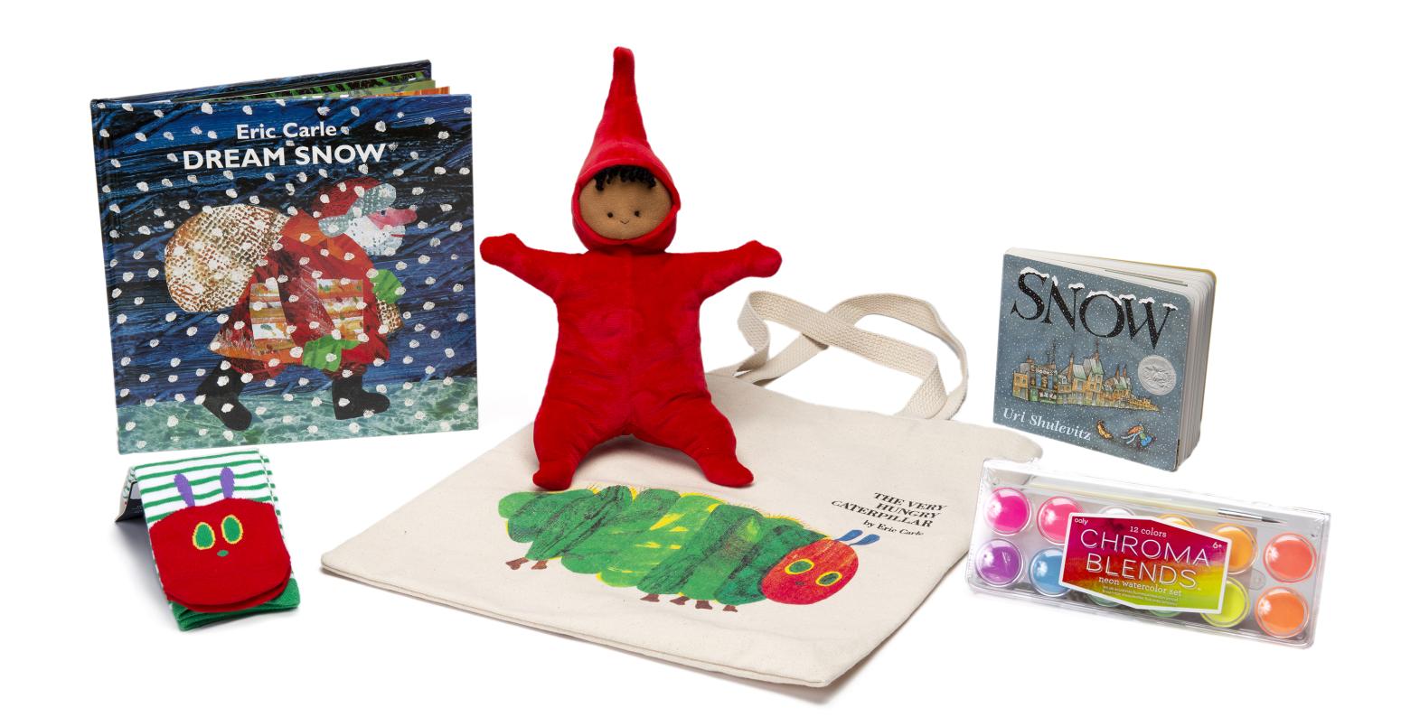 An assortment of gifts including children's books, art supplies and plush doll.