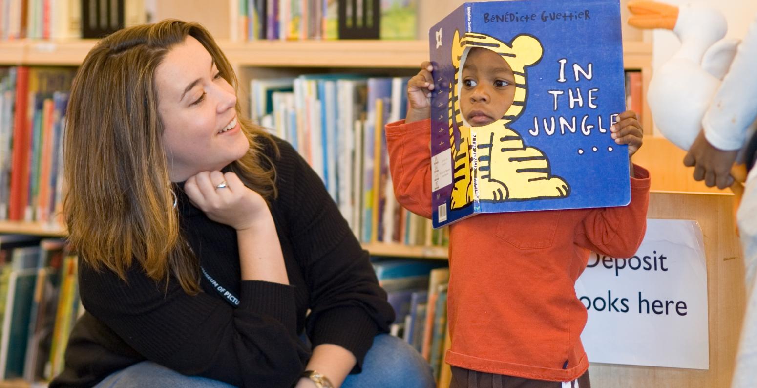 Megan Dowd Lambert and child during Whole Book Approach storytime.