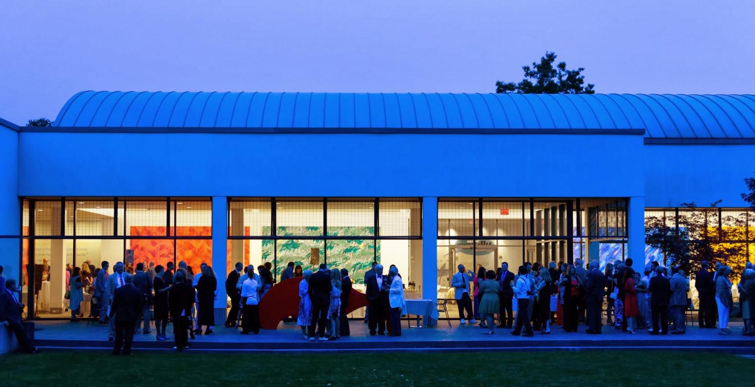 The Carle exterior view at night with crowd