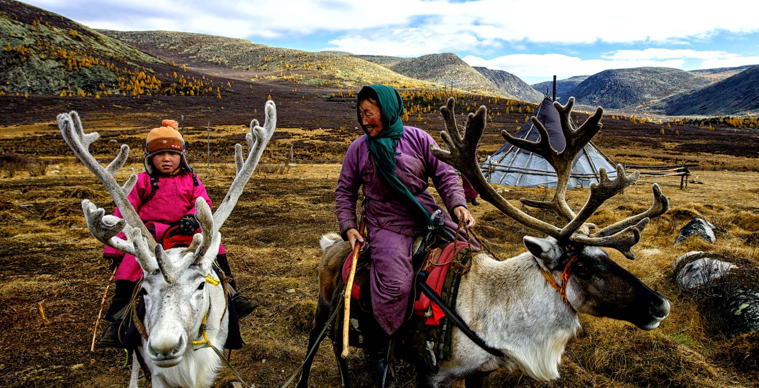 Photograph of reindeer herders. 
