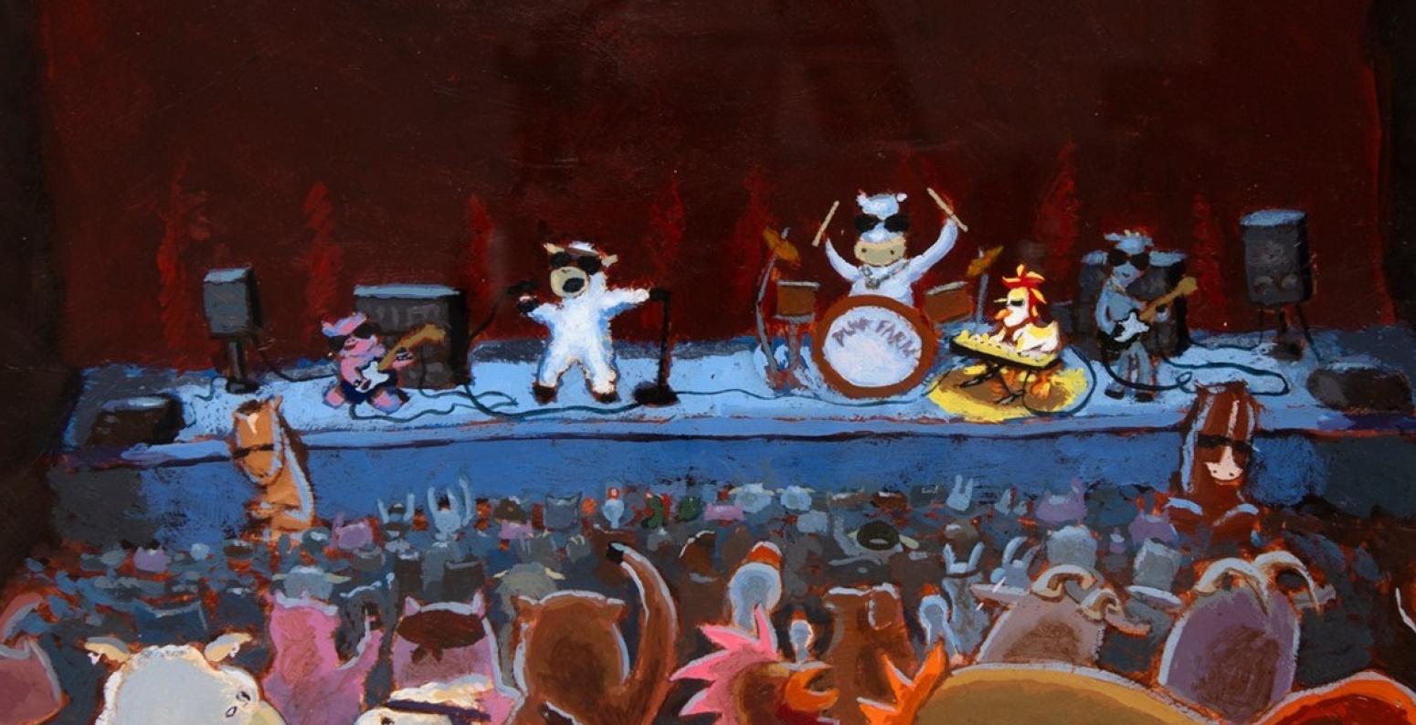 Farm animals performing on a stage at a concert.