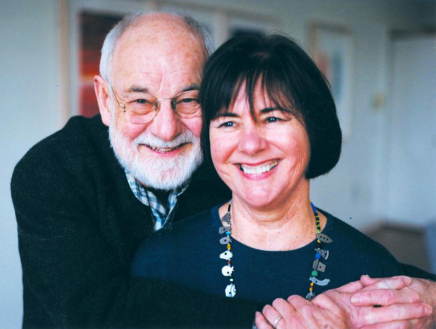 Eric and Barbara Carle holding each other and smiling