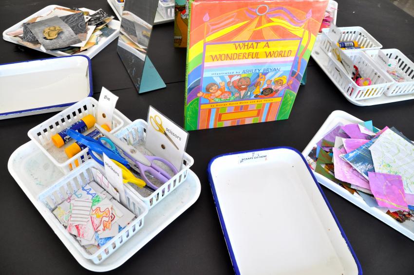 Trays of materials and books on a table