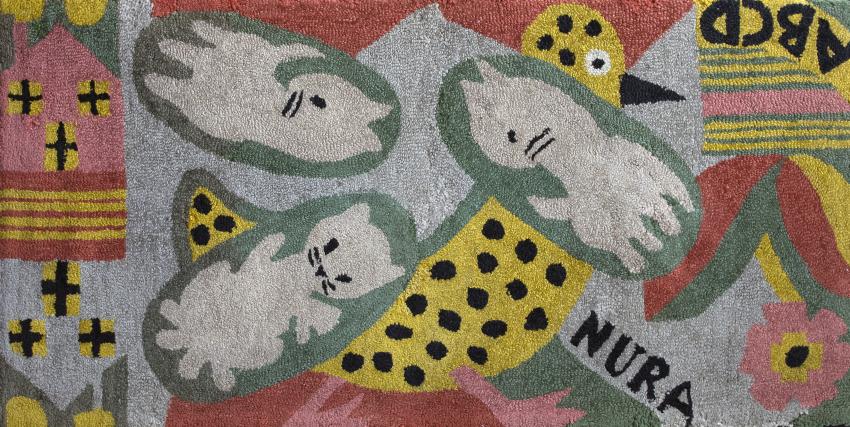 Hooked rug with cats and abstract polkadot forms.