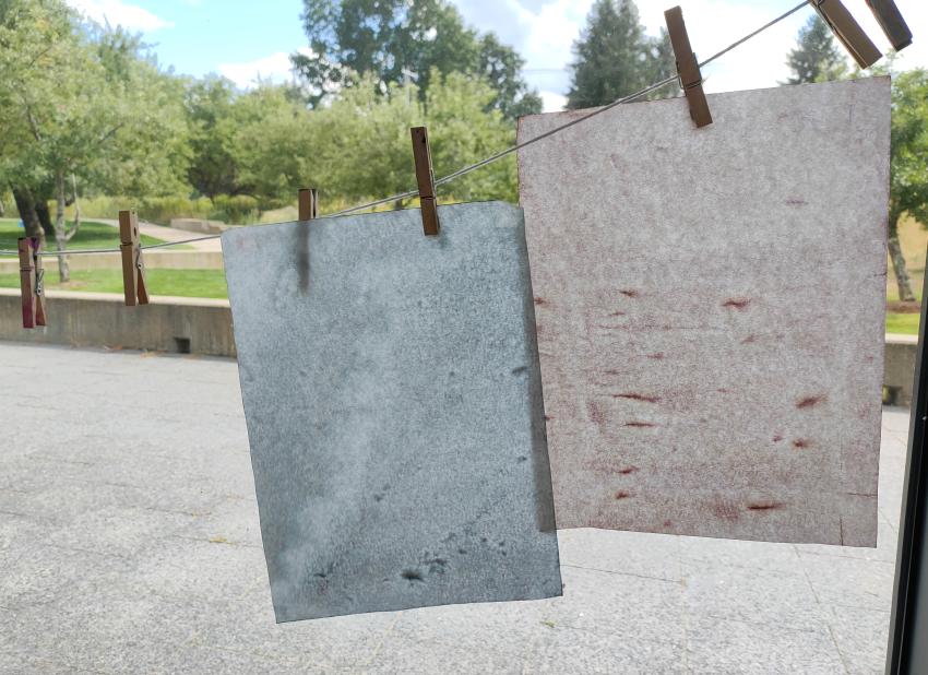 Dyed papers used for batik stamping after several hours of being layered with other papers on a tray.