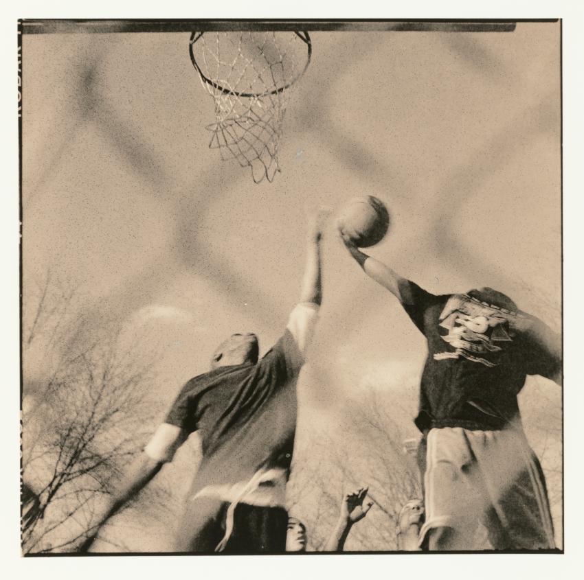 Photograph of two basketball players. 