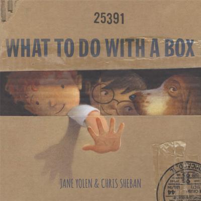 Cover image for What To Do With a Box shows two children and a dog inside a big cardboard box peeking out of an opening.