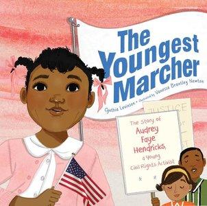 Cover image for The Youngest Marcher shows young Audrey Fay Hendricks as a young girl wearing a pink cardigan carrying a miniature American flag. Two people carrry a sign and walk behind her.