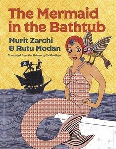 A mermaid sits on the edge of a bathtub with a bird perched on her shoulder. A pirate ship on the ocean is seen in the background.