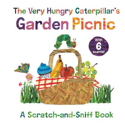 The Very Hungry Caterpillar sits atop a picnic basket of various foods sitting in the grass.