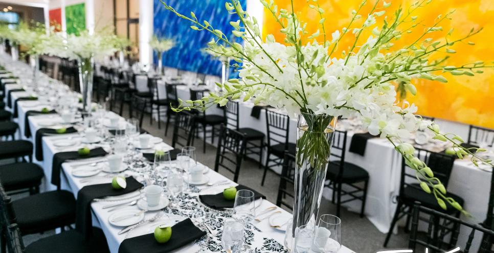 Two long banquet tables set up for a wedding. 