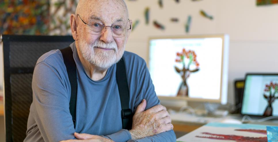 Photograph of Eric Carle in his studio. 