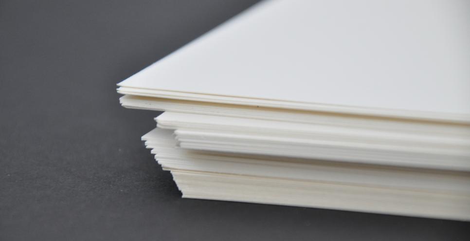 A stack of white watercolor paper. 