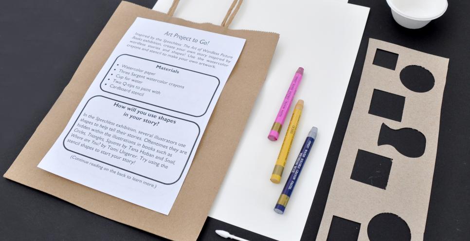 The materials within a watercolor to-go bag: a cup, two cotton swabs, a stencil, three watercolor crayons, two watercolor papers, a paper bag, and a flyer. 
