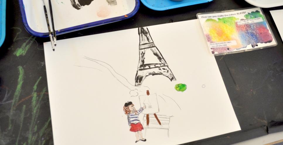 A watercolor painting of a girl painting in front of the Eiffel Tower.