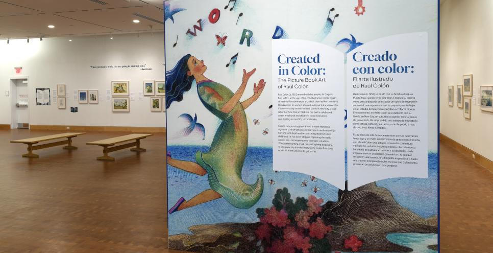 Photograph of gallery showing framed art and graphics. 