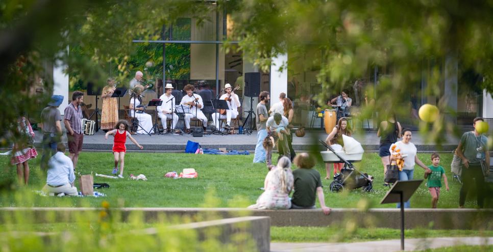 Guests in the courtyard enjoying music during Summer Nights program.