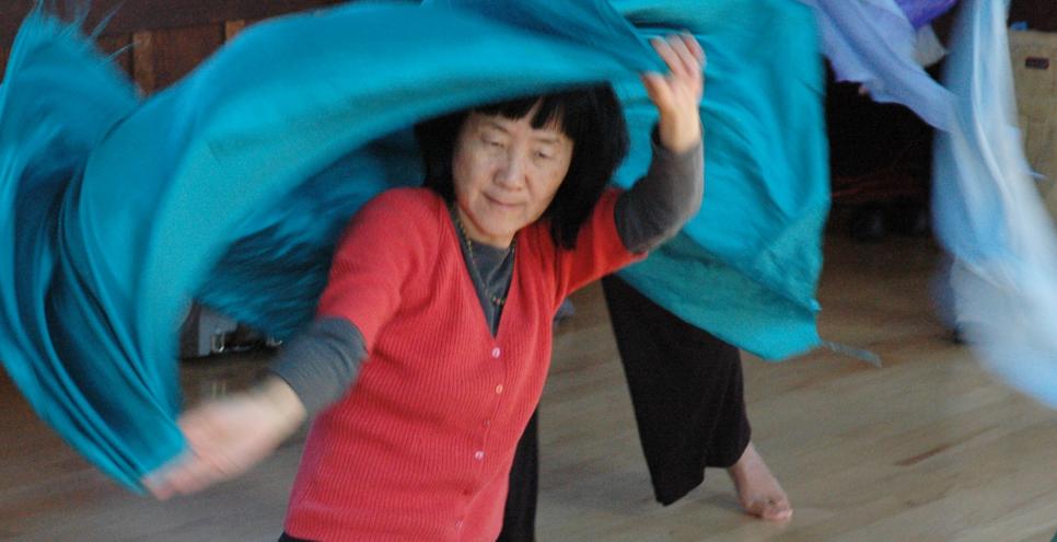 Woman dancing with fabric