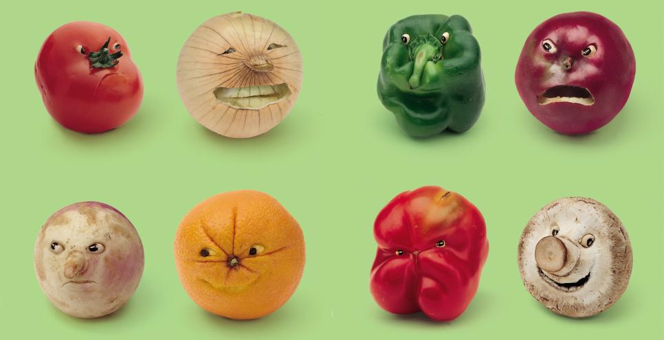Eight vegetables with faces making different expressions against a green background.