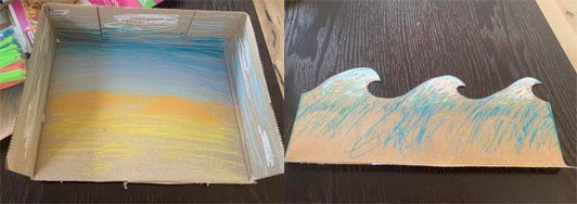 Two side by side images, the first showing a cardboard box from above with one side removed. The interior of the box has been colored in to create a beach scene. The second image shows how the removed side of the cardboard box has been cut into the shape of waves.