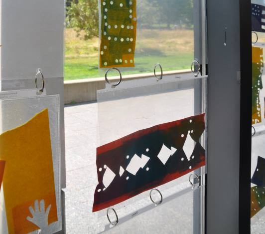 close up of stencils on display in the Art Studio windows