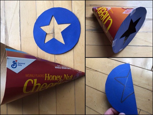 A cardboard cone with a cut-out star taped together so the star is at the bottom of the cone.