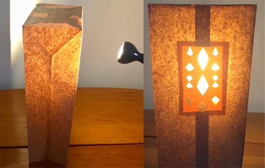 Two images: A brown paper bag sitting safely away from a lamp is glowing with light. A window is cut out of the bag and diamond cut-outs are shining as the light is coming through.
