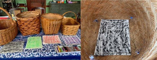 A line-up of four wicker baskets with papers laid in front of them. Each paper was a different rubbing made from the baskets. A black texture rubbing inside of the wicker basket where the texture came from.